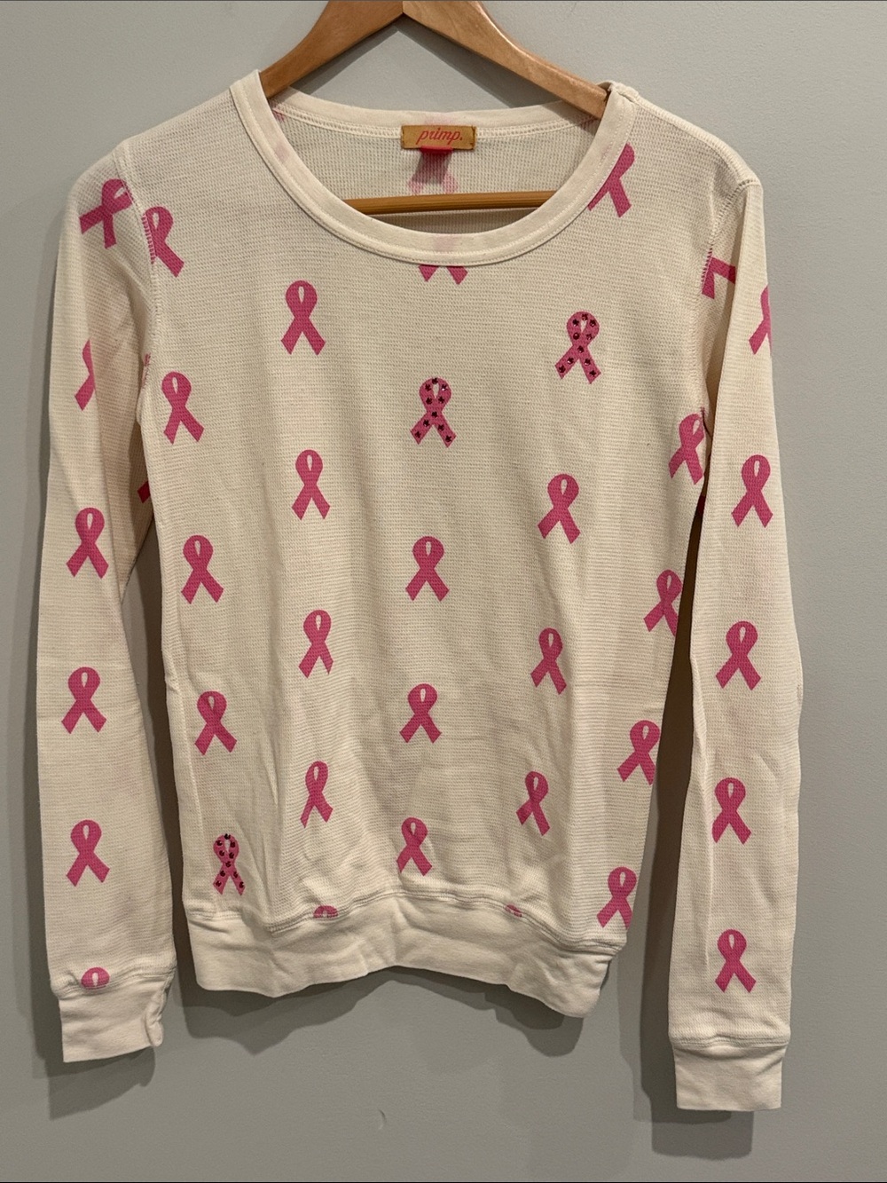 Primp Cream Waffle Crewneck with Pink Ribbon Print and rhinestone detail